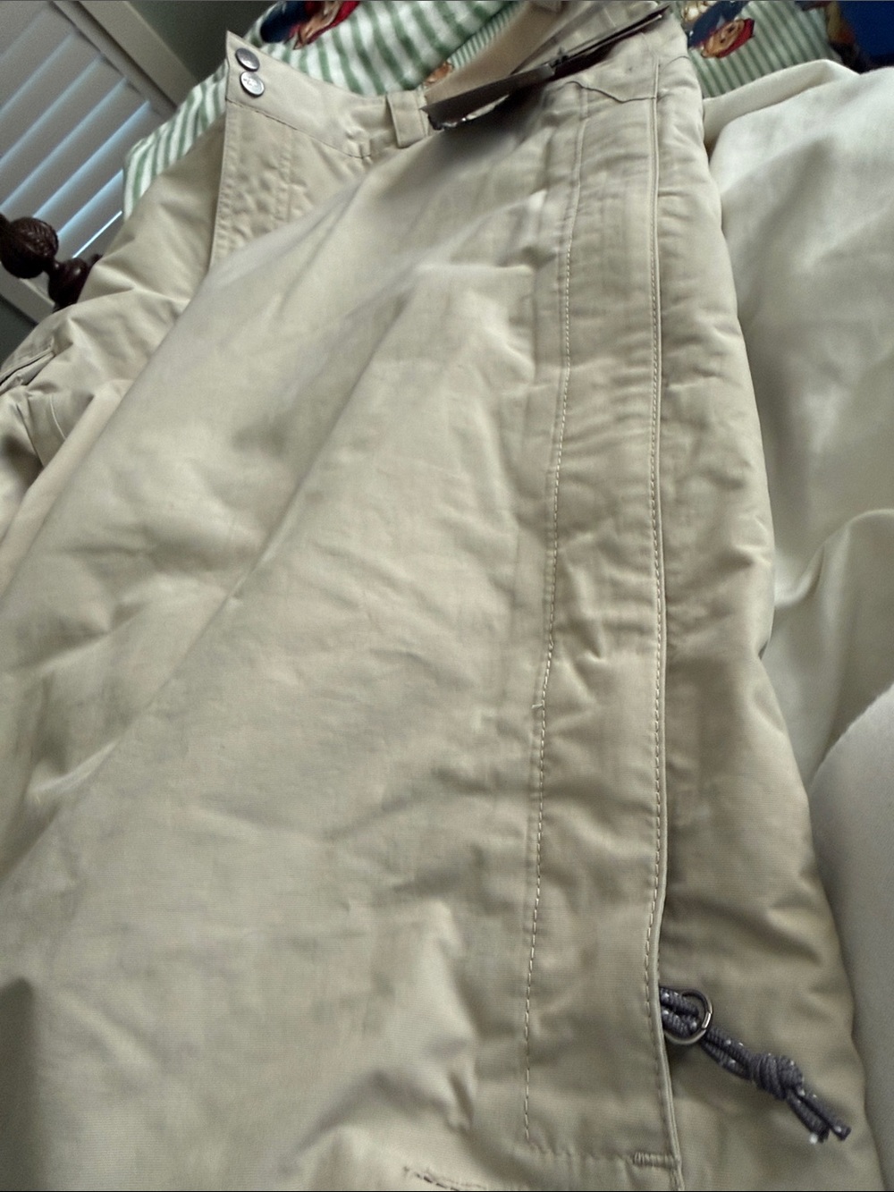 The North Face tan men's pants with red branded tag